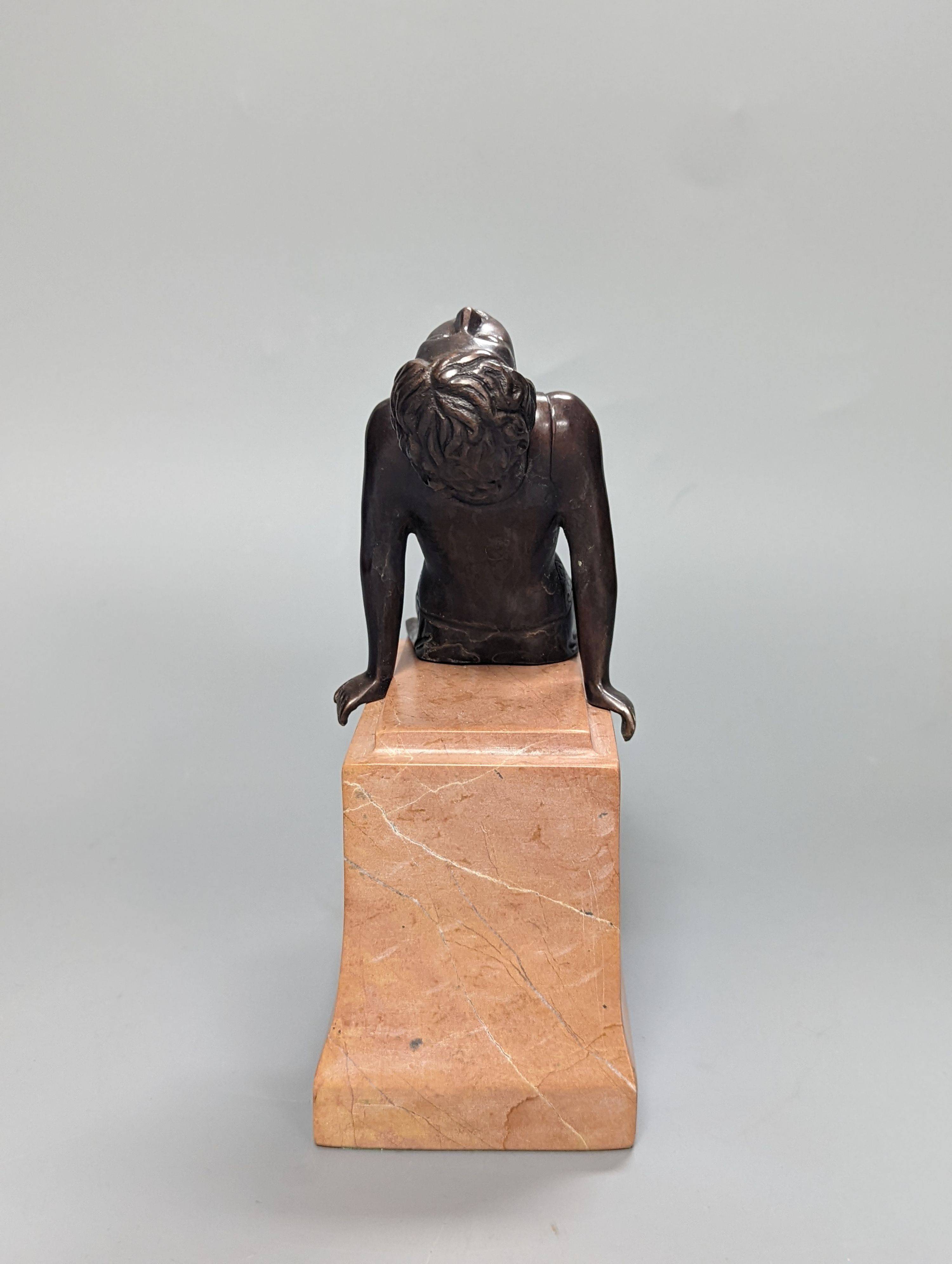 A French Art Deco style bronze of a reclining lady, on marble plinth 18cm